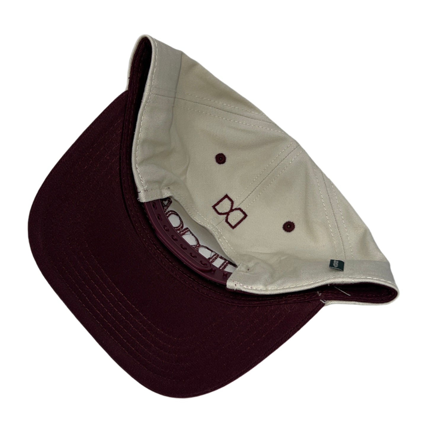 Two caps, one brown and one beige, on a white background