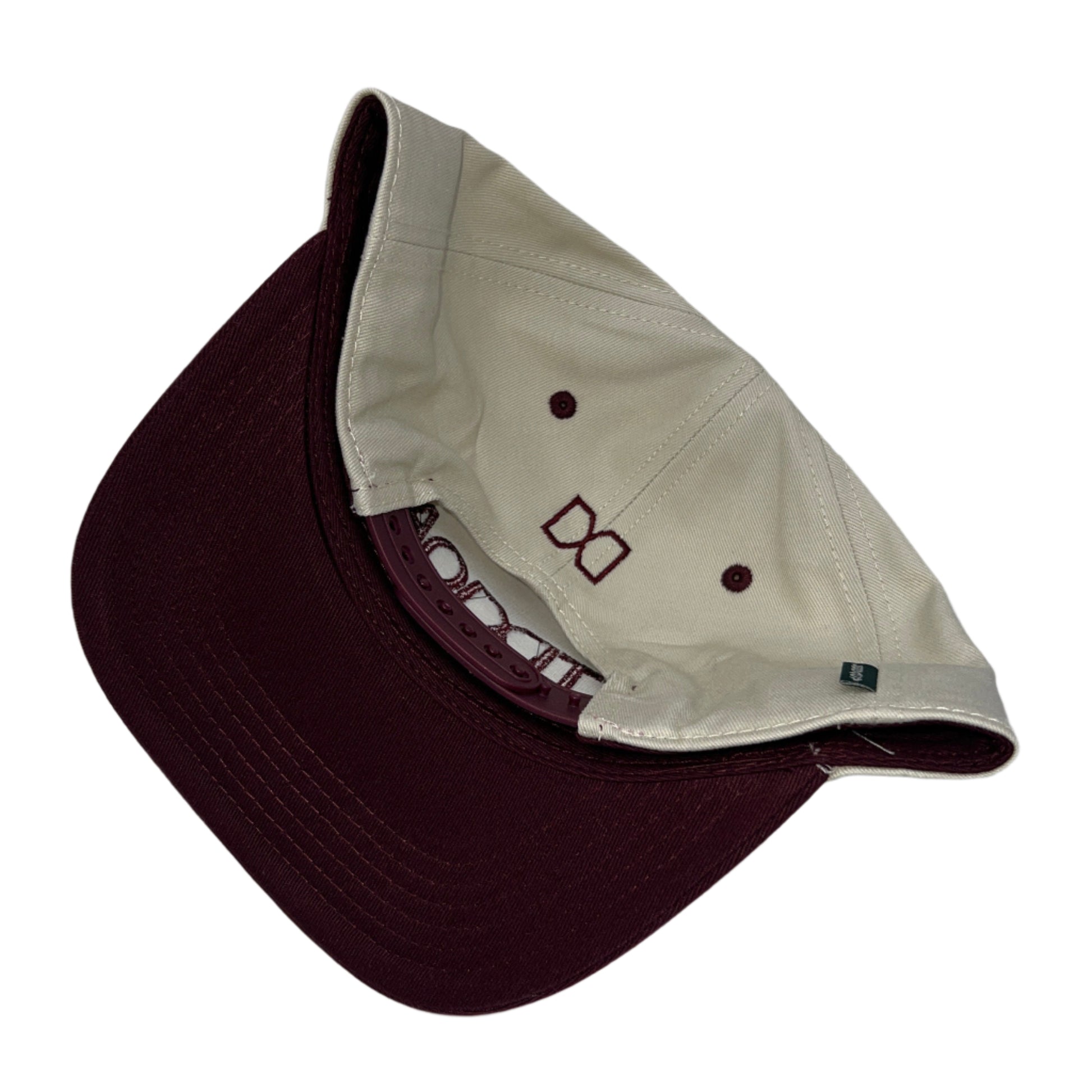 Two caps, one brown and one beige, on a white background