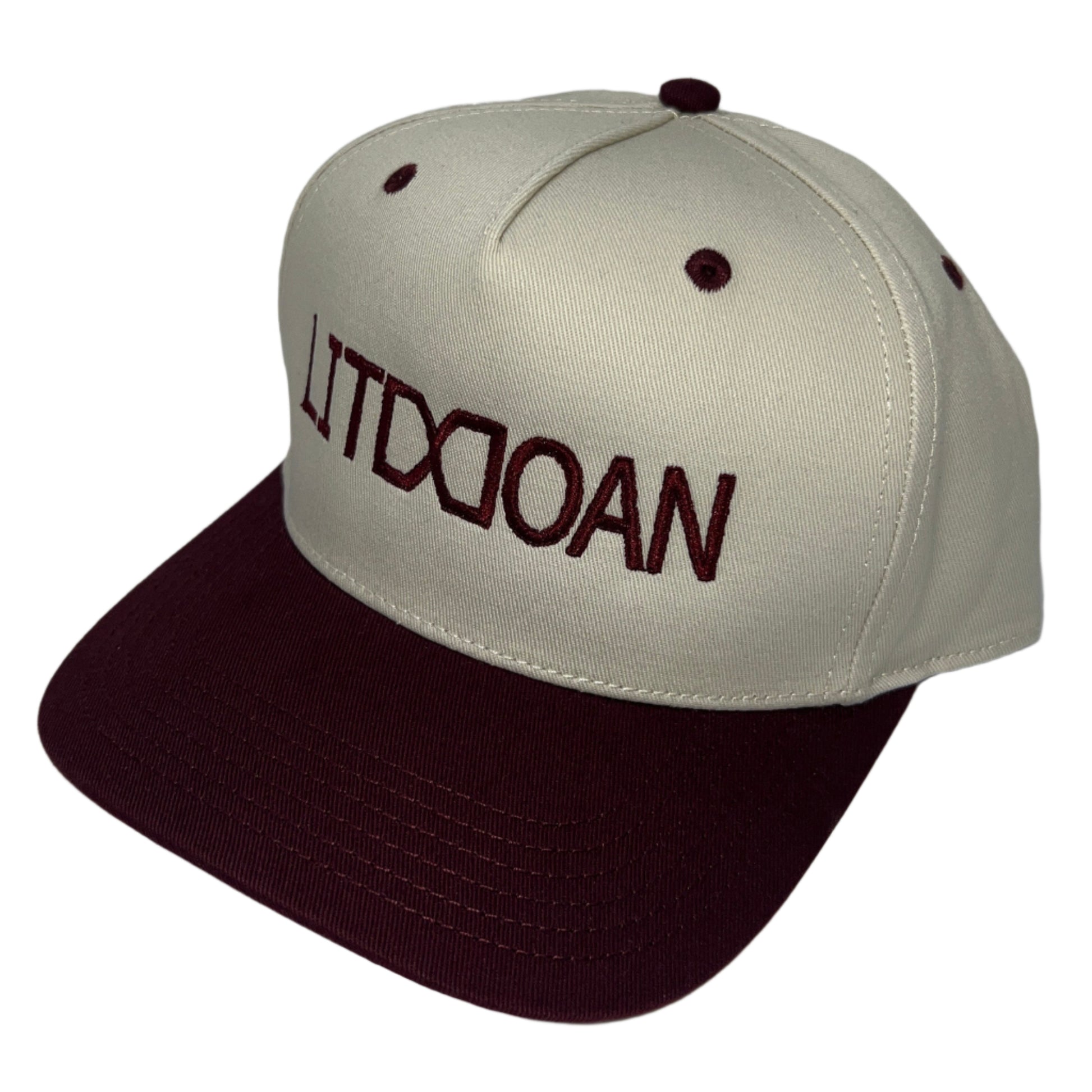 Beige and brown cap with text on a white background