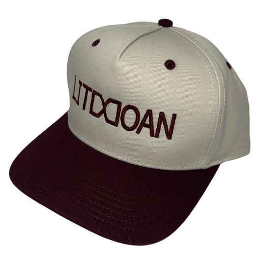 Beige and brown cap with text on a white background