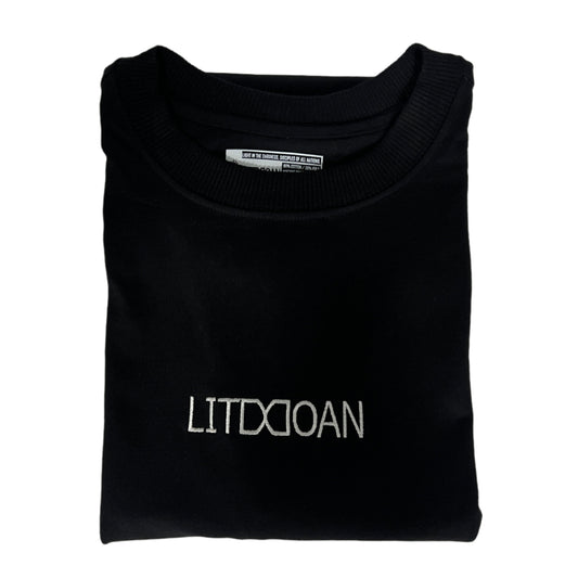 Folded black supper heavyweight tee with 'LITDDOAN' branding on a light white background
