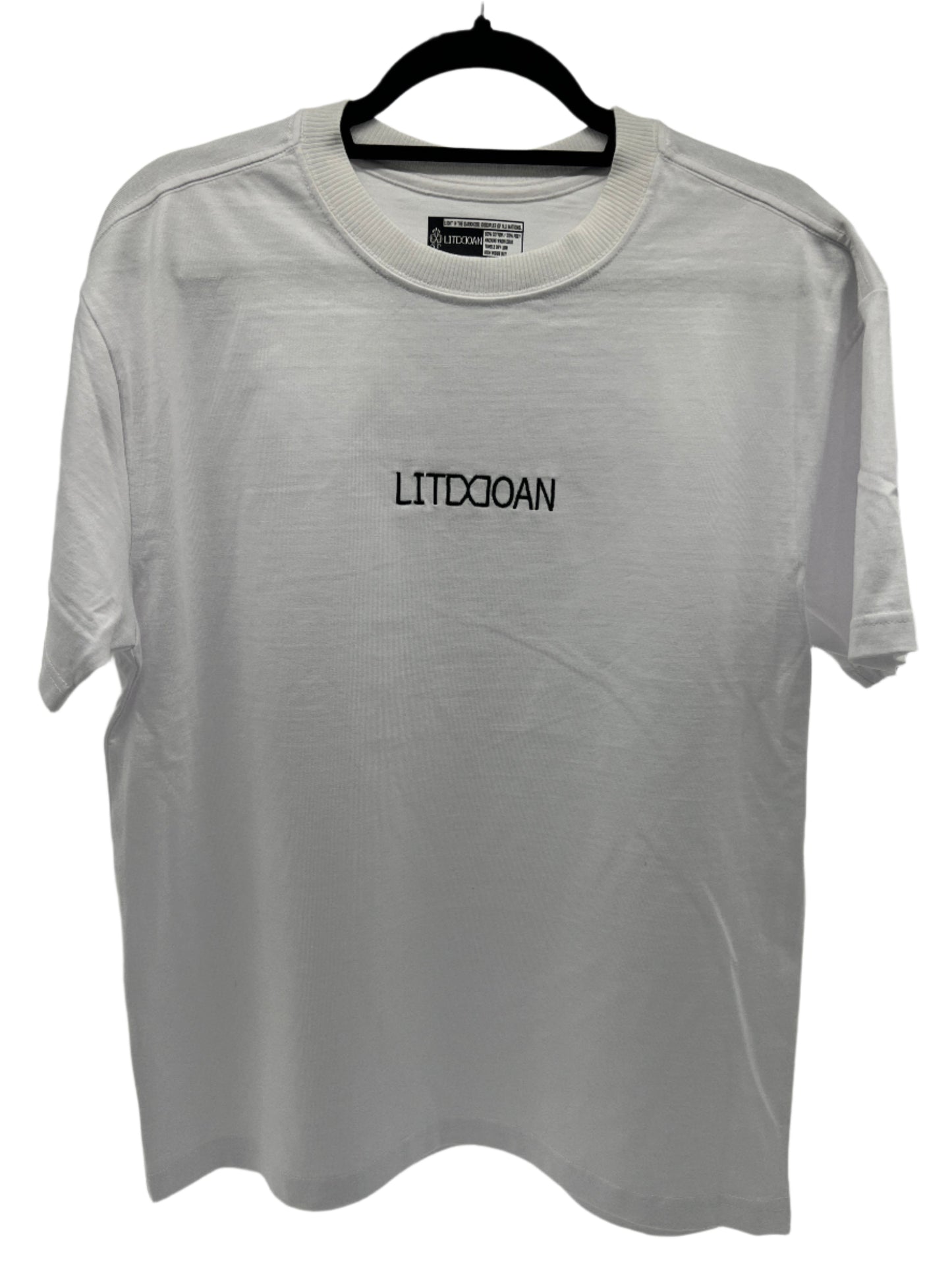 White t-shirt with 'LITDDOAN' text on a hanger inside a transparent plastic bag.
