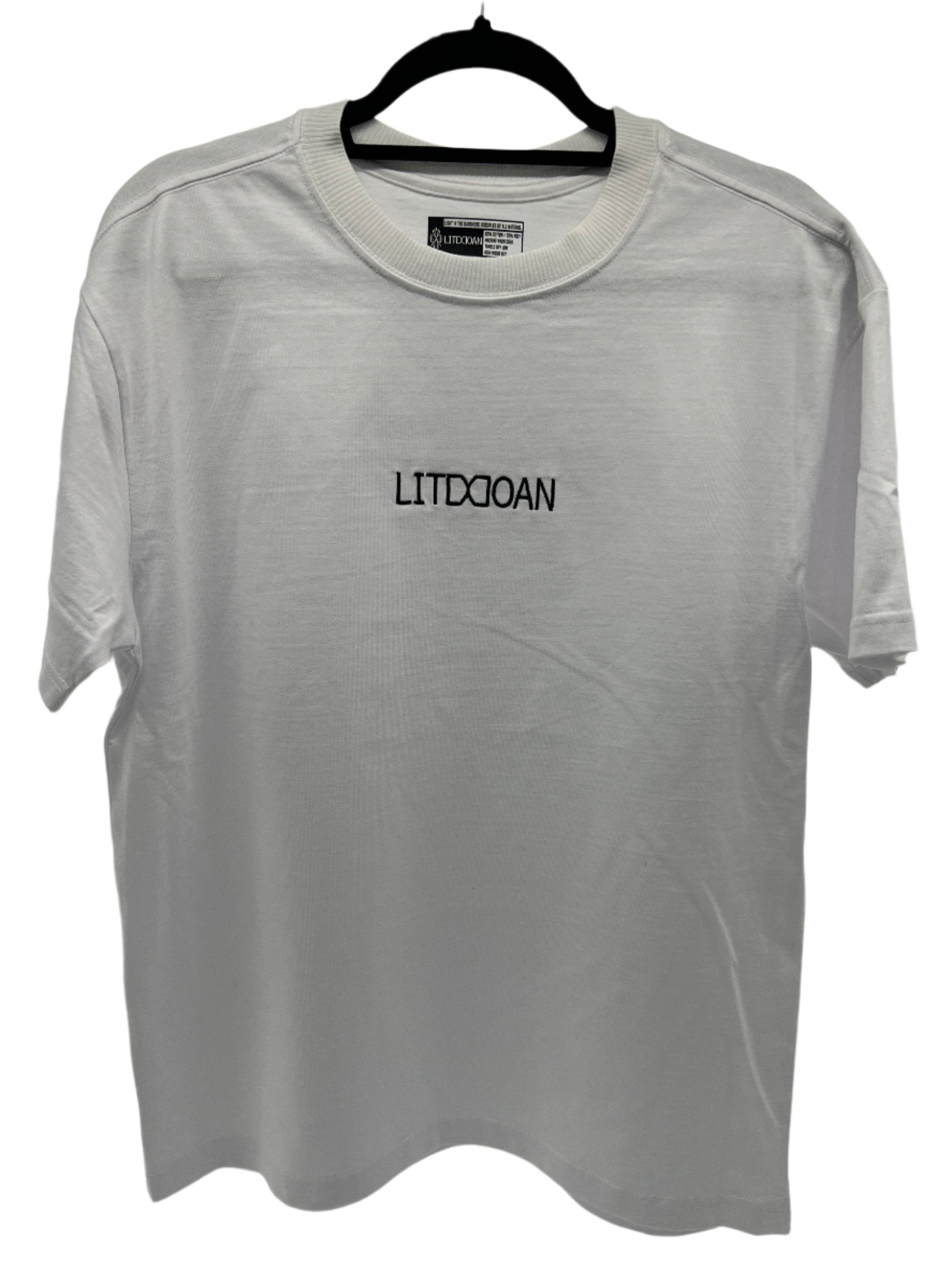 White t-shirt with 'LITDDOAN' text on a hanger inside a transparent plastic bag.