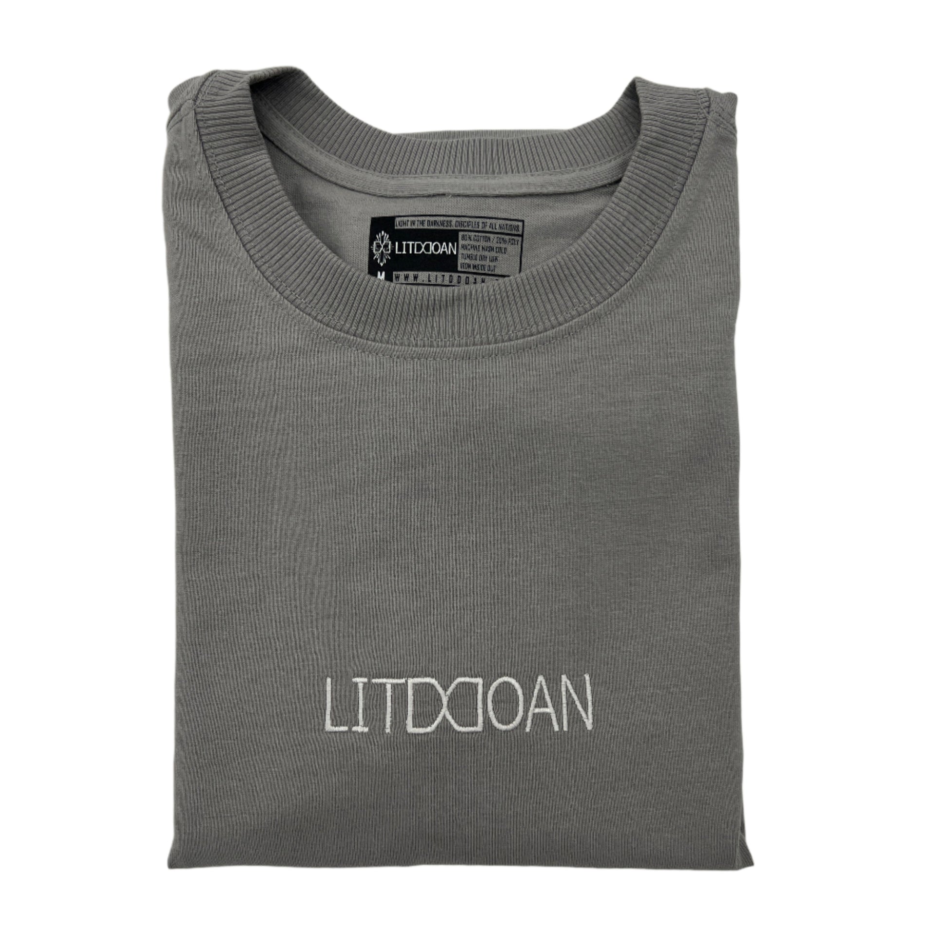 Folded gray t-shirt with 'LITDDOAN' text on a light gray background